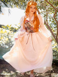 NSPSTT vintage floral jacquard puff sleeve maxi dress worn by woman in sunny outdoor garden setting