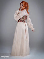 Side view of NSPSTT vintage floral jacquard puff sleeve dress with corset waist and full length skirt