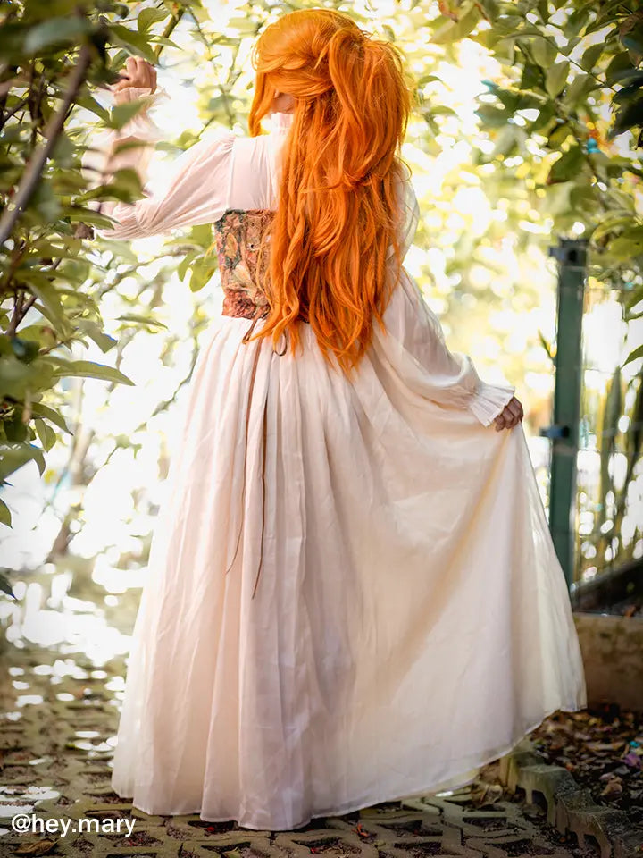 Back view of NSPSTT vintage floral jacquard maxi dress showing flowing skirt and romantic silhouette outdoors